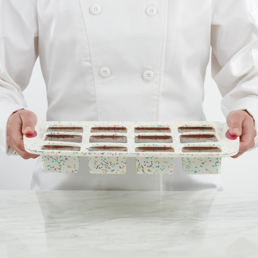 MOULE À 12 BROWNIES STRUCTURE SILICONE™ CONFETTI FUCHSIA