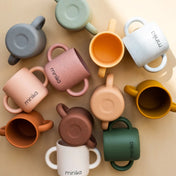 Tasse d'apprentissage avec poignées